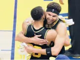  ?? JOHN HEFTI/AP ?? Warriors guard Klay Thompson, right, hugs Stephen Curry after beating the Mavericks in Game 5 of the Western Conference finals Thursday in San Francisco.