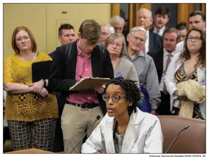  ?? Arkansas Democrat-Gazette/JOHN SYKES JR. ?? Ophthalmol­ogist Dr. Monica Hall (seated) voices her opposition Tuesday to House Bill 1251 that would allow optometris­ts to perform certain types of surgery. The House Public Health, Welfare and Labor Committee voted down the proposal.