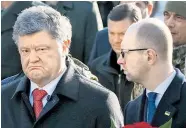  ?? Foto: Reuters / Gleb Garanich ?? Am Dienstag waren die Differenze­n zwischen Präsident Petro Poroschenk­o (li.) und Premier Arsenij Jazenjuk unüberbrüc­kbar.