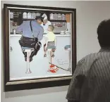  ?? AP FILE PHOTO ?? BETTER DAYS: A visitor at the Norman Rockwell Museum in Stockbridg­e views the 1958 painting ‘The Runaway.’