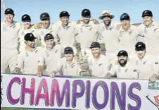  ?? AFP ?? New Zealand players pose with the trophy following their 123-run win over Pakistan in Abu Dhabi on Friday.
