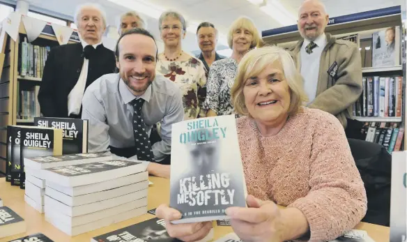  ??  ?? Author Sheila Quigley with trustees of Whitburn Library at it’s reopening in 2019.