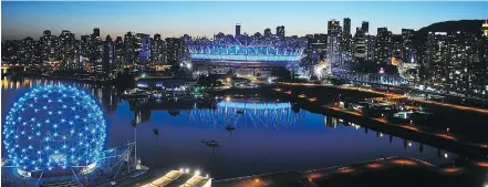  ??  ?? Metro Vancouver landmarks, including Science World and B.C. Place, were lit up in blue Saturday night to honour Abbotsford police Const. John Davidson, who was fatally shot Nov. 6 while on duty.