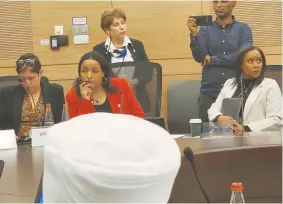  ?? (Yosef Abramowitz) ?? LIKUD MK Tsega Melaku (center) advances a bill in the Knesset Constituti­on, Law, and Justice Committee, last week, to expunge police records of Ethiopian Israelis arrested while protesting the police killing of Solomon Tekah in 2019. National Unity MK Pnina Tamano-Shata (right), a former aliyah minister, supports the bill.