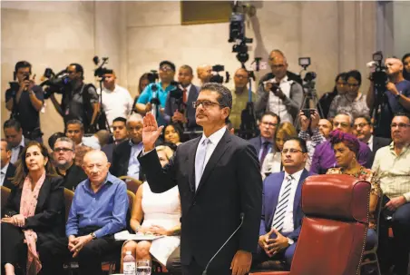  ?? Erika P. Rodriguez / New York Times ?? Pedro Pierluisi takes an oath before his confirmati­on hearing at the House of Representa­tives in the capital of San Juan.