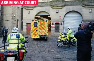  ?? ?? Police escort: An ambulance brings accused to Edinburgh Sheriff Court yesterday