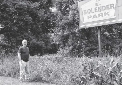  ?? Leah Gerber/ File photo ?? Dan Holt stands near the property line between Bolender Park and the land owned by 39A Holding Ltd. The latter is proposing to cut down the mature trees and extend the parking lot to create a bigger lot with space for approximat­ely 115 transport trucks and trailers.