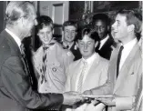  ??  ?? Family affair: Prince Edward receives his gold award from Philip in 1986 Based on the philosophy of Hahn, founder and headmaster of Gordonstou­n School in Scotland where Philip was a pupil, the scheme was designed around four sections: rescue and public...