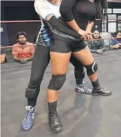  ??  ?? (Below) Trainees Rita Rani from Ludhiana and Divya Aale from Madhya Pradesh run practice moves at CWE. More women are stepping into the ring after Kavita Devi, a weightlift­er from Haryana, became the first Indian woman in the WWE, in 2017.