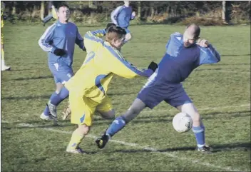  ??  ?? CUP UPSET ... Mick Bates of Staxton (blue shirt) challenges with Seamer’s Neil Fraser (yellow), left 1220346d, while Bates attempts to challenge for the ball in Staxton’s shock 6-2 cup defeat to Seamer, above 120364a Pictures: Steve Lilly