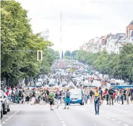  ?? AP ?? Demonstrat­ors walk along Bismarckst­rasse in Berlin on Sunday.