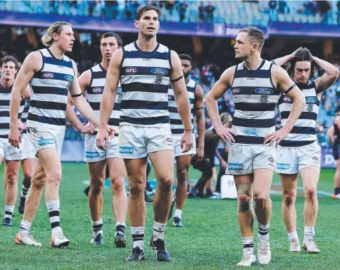  ?? Picture: Will Russell/AFL Photos via Getty Images ?? CAN WE FIX THIS? The Cats leave the field after being beaten by the Dockers.