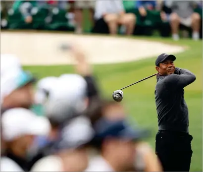  ?? ?? Tiger Woods plays a shot during the Masters preview day yesterday at Augusta National in Georgia