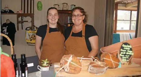  ?? PHOTO: KIM MICKE ?? MAKING ENDS MEET: The Farm Gate Cafe owner Lee-Ann Simpson (right) with her daughter Alysia Simpson.