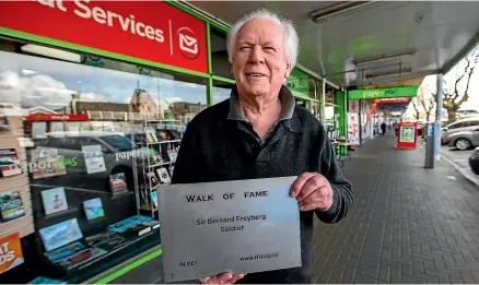  ?? DAVID UNWIN/STUFF ?? The newly formed Heritage Horowhenua Trust is creating a walk of fame down Oxford St, Levin. Trustee Kerry Geertson holds a prototype plaque honouring Sir Bernard Freyberg.