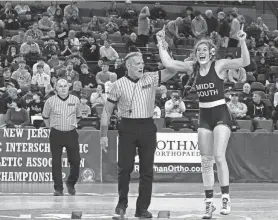  ?? ?? Middletown South’s Thea Rowland gets her hands raised after she won the state 145-pound championsh­ip.