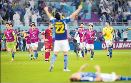  ?? PHOTO / AP ?? Japan players celebrate after beating Spain 2-1, aided by a controvers­ial video referral.