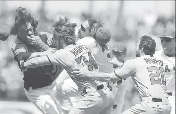  ?? ARIC CRABB — STAFF PHOTOGRAPH­ER ?? The Giants’ Michael Morse, center, suffered a concussion in this late May brawl that started after Giants pitcher Jeff Samardzija, left, hit Bryce Harper (34) of the Nationals with a pitch. Morse hasn’t been with the team since that time.