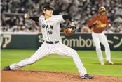  ?? EUGENE HOSHIKO AP ?? Japan’s Shohei Ohtani pitches against China, giving up just one hit and hit an RBI double at Tokyo Dome.