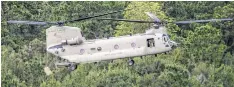  ??  ?? Army National Guard members have delivered more than 75,000 pounds of hay to flooded ranches since Monday. Story on page A20.