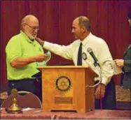  ?? PHOTOS BY LEAH MCDONALD — ONEIDA DAILY DISPATCH ?? Randy Domes accepts the Oneida Rotary’s Bill Fariel Award for Vocational Excellence from Hank Leo on Tuesday.