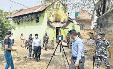  ?? ANI ?? CBI experts inspect the houses burnt during Birbhum violence.