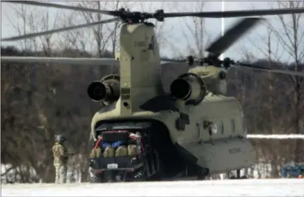  ?? CHARLES PRITCHARD — ONEIDA DAILY DISPATCH ?? A CH-47Chinook helicopter piloted by a Civil Support Strike Team lands on the Hamilton College rugby field as part of an emergency response exercise on Monday, March 18, 2019.