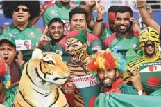  ?? Ahmed Kutty/Gulf News ?? Bangladesh supporters at the Zayed Cricket Stadium in Abu Dhabi during their team’s match with Afghanista­n.