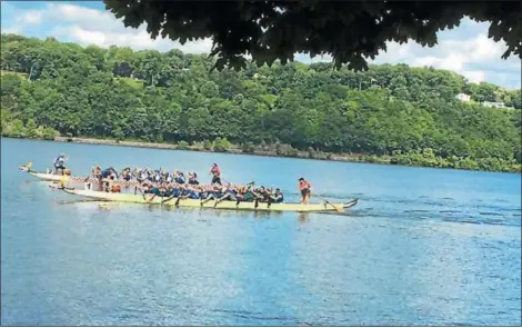  ?? PHOTOS PROVIDED BY DRAGONS ALIVE. ?? Capital Region dragon boat team Dragons Alive participat­es in the Dutchess Dragon Boat Race &amp; Festival on Saturday in Poughkeeps­ie. On Aug. 18, the group will be part of a new local dragon boat event in Waterford.
