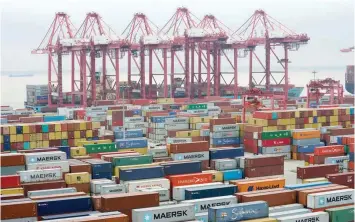  ?? — Reuters ?? Containers are seen at the Yangshan Deep Water Port in Shanghai, China.