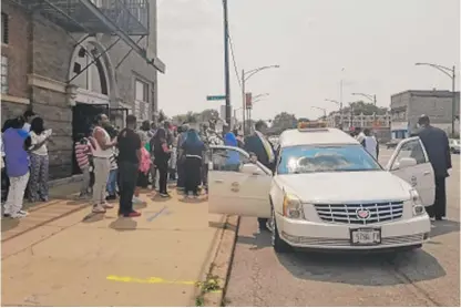  ?? MANNY RAMOS/SUN-TIMES ?? Mourners gather in front of Bethlehem Star Missionary Baptist Church for Kendall Brown’s funeral Tuesday.