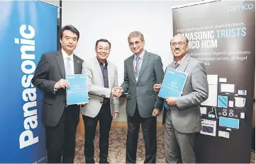  ??  ?? Cheng (second, left) shakes hand with vice chairman and managing director Ramco Systems Sdn Bhd P.R Venketrama Raja (second, right) during Signing Ceremony Multi- Million Dollar Cloud HR and Payroll Transforma­tion between Panasonic and Ramco Systems....