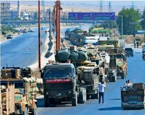  ?? AP ?? AT STANDSTILL: A Turkey Armed Forces convoy is seen at a highway between Maaret Al Numan and Khan Sheikhoun in Idlib province, Syria, on Monday. —