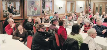  ??  NATI HARNIK/THE ASSOCIATED PRESS FILES ?? Attorney Dave Domina, reflected in the mirror top left, briefs landowners and activists on developmen­ts in the fight against the Keystone XL pipeline during a meeting in York, Nebraska, last month. Thursday, a Holt County judge issued a temporary...