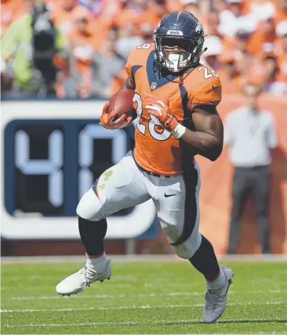  ?? Eric Lutzens, The Denver Post ?? Broncos running back Royce Freeman, gaining yardage against the Seattle Seahawks, might get back on the field Sunday against the Los Angeles Chargers.