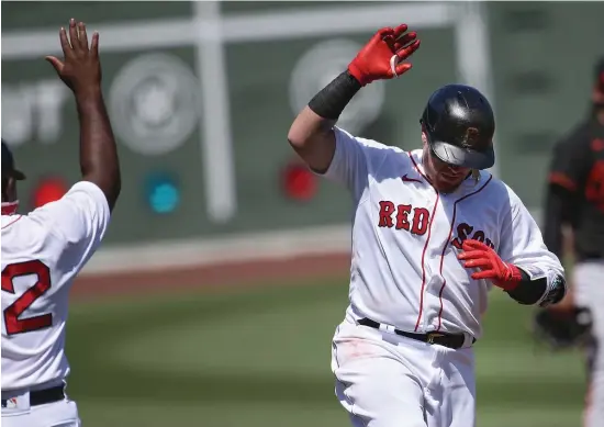  ?? NAncy lAnE / HErAld stAFF ?? PLAYING IT SAFE: Red Sox catcher Christian Vazquez celebrates his home run on Sunday against the Orioles.