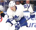  ?? Jeffrey T. Barnes/AP file ?? ■ Toronto Maple Leafs forward Jason Spezza (19) controls the puck on Feb. 16 against the Buffalo Sabres in Buffalo, N.Y. Mixed with the excitement of hockey being back is the uncertaint­y of which and how many players may opt out and how the long layoff could contribute to injuries.