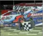  ?? SUBMITTED PHOTO - RICH KEPNER ?? Craig Von Dohren celebrates in victory lane after winning the modified feature on May 28at Grandview.