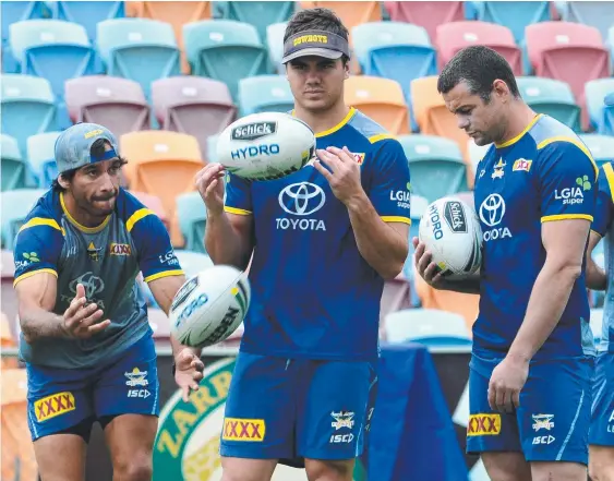  ?? FINDING CONFIDENCE: Young Cowboys playmaker Jake Clifford ( centre) at team training with Johnathan Thurston ( left) and Shaun Fensom. Picture: EVAN MORGAN ??