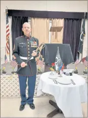  ?? PHOTO BY CAROLE HESTER ?? Daniel Harreschou, M.sgt. (Ret.) USMC, at the POW/MIA table. The table is set for one, symbolizin­g those members of the Corps who are missing, referred to as POWS and MIAS (Prisoner Of War and Missing In Action).