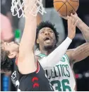  ??  ?? The Celtics’ Marcus Smart drives to the basket ahead of the Raptors’ Marc Gasol during the second half Saturday in Lake Buena Vista, Fla.