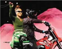  ??  ?? Rihanna rides on a motorcycle after showing her fashion collection from Fenty Puma by Rihanna during Fashion Week.