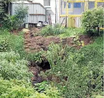  ?? PHOTOS: TOM LEE/STUFF ?? Right: A slip at the rear of a property in Dermont Street, Bader.
Far right: The slip has ruptured a wastewater pipe.