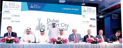  ?? Supplied photo ?? Sheikh Ahmed and other officials during the signing ceremony of the Dubai Smart City Accelerato­r on Wednesday. —