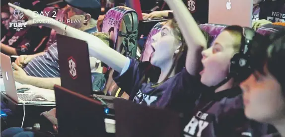  ?? Provided by Maria Gambale, Super League Gaming file ?? New York Fury team competitor­s react during a Super League Gaming competitio­n against a team from Boston at City Center 15 Cinema de Lux in White Plains, N.Y., on Nov. 17.