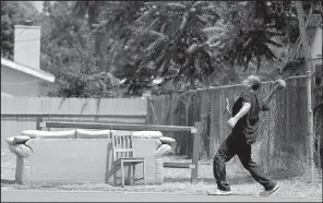  ?? AP/CHRIS CARLSON ?? A San Bernardino, Calif., resident is pictured on Thursday. San Bernardino’s police chief said the city has taken no formal steps to declare itself a sanctuary city.