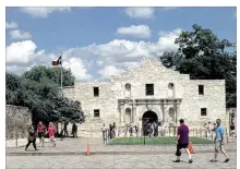  ?? JOE BARRERA JR. / SAN ANTONIO EXPRESS NEWS ?? For years, people have complained that Alamo Plaza is anything but a reverent battle site, with traffic, raspa vendors, street preachers and amusement attraction­s.