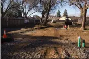  ?? ?? Installed lines for gas and sewage are seen Wednesday at the Everhart Village emergency shelter project site in Chico. Twenty cabins with kitchen and bath are planned to be installed.