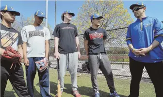  ?? HERALD PHOTO BY JOSEPH PREZIOSO ?? AT ATTENTION: East Boston pitcher Jake Scanlan warms up (left) then listens to coach Jeff Arinella (above right) along with his teammates during a recent practice. The Jets are out to a 6-0 start and have their eyes on a Div. 3 state title.