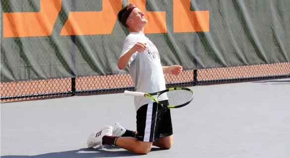  ?? News) (Photo by Bill Kallenberg, for Starkville Daily ?? Giovanni Oradini falls to his knees after clinching Saturday's win at the Southeaste­rn Conference Tournament for Mississipp­i State.